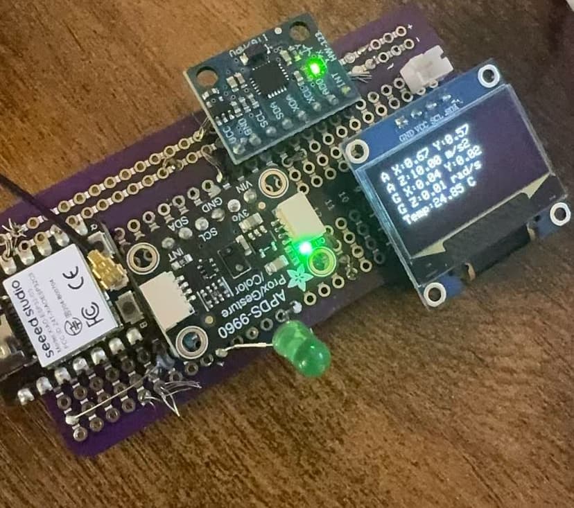 IMU-only prototype showing ESP32-C3 with sensors and OLED display
